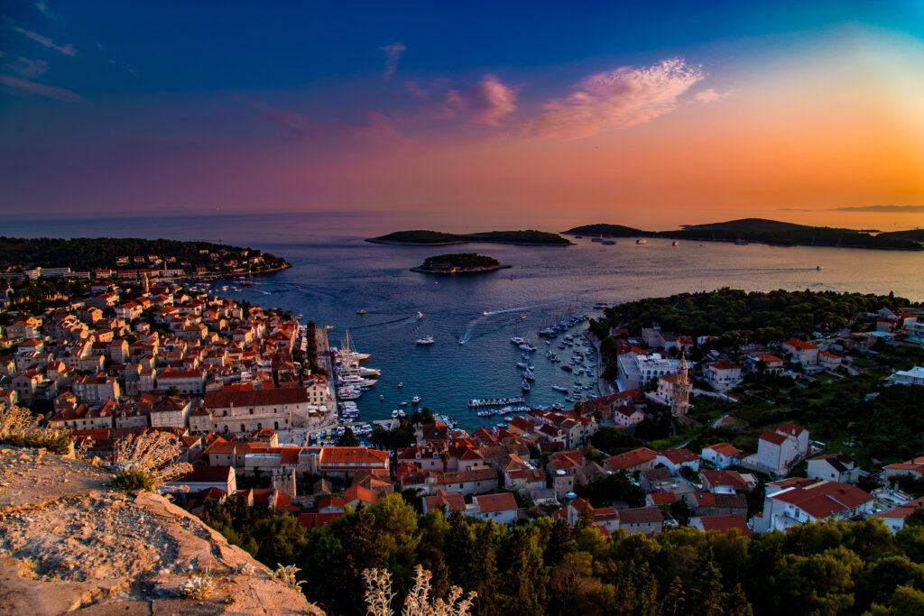 Croatia sunset setting over the islands in the distance from the city of Hvar