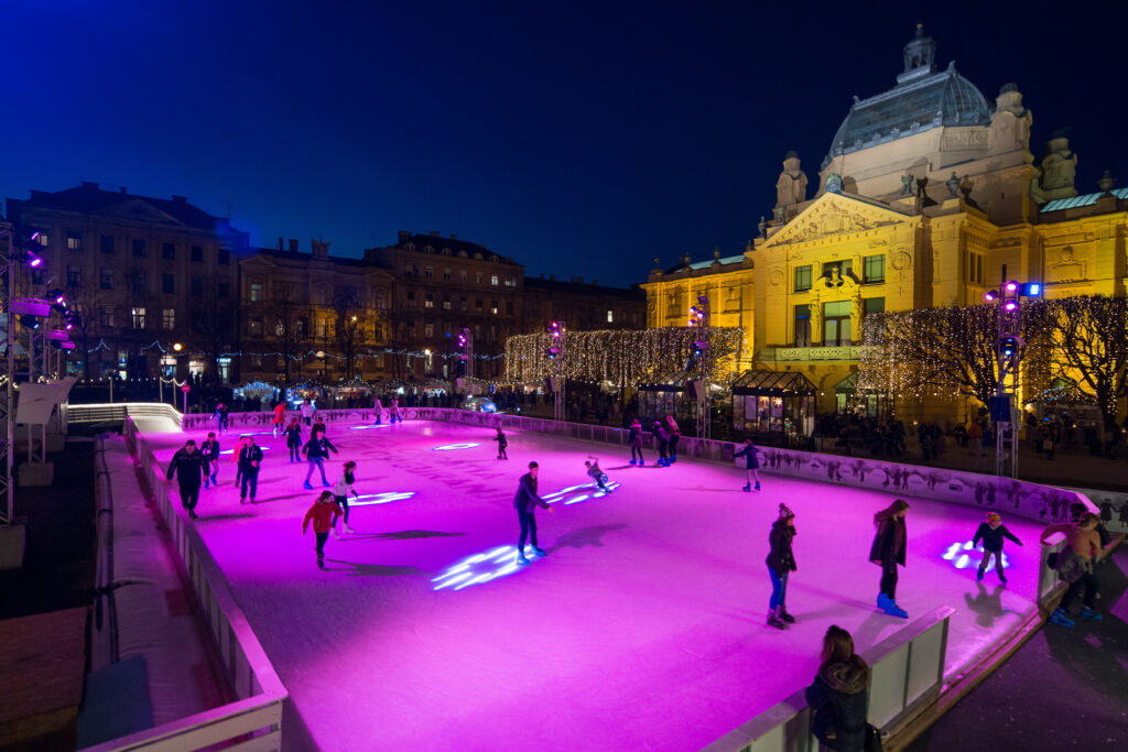 Croatian Christmas markets - Advent Zagreb with ice skating in King Tomislav Square outside the national theatre at night