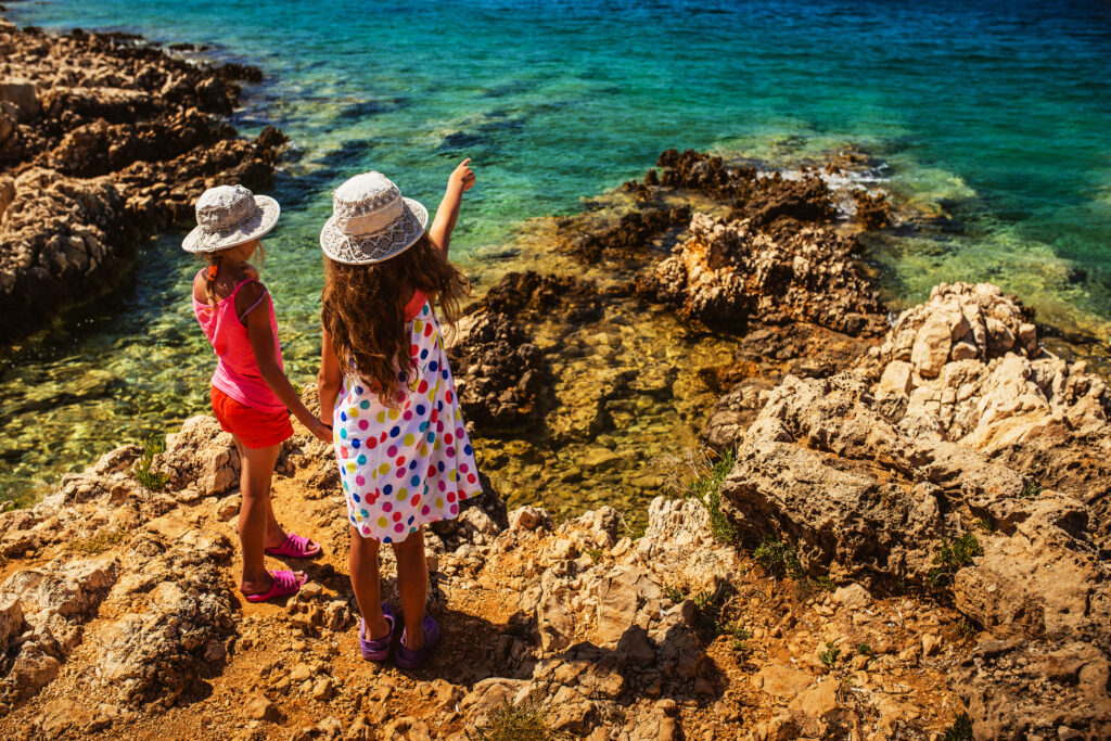 how safe is Croatia for travel - two children looking at the ocean in croatia
