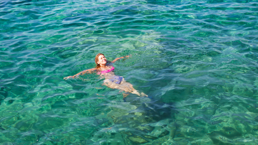 Woman swimming in the sea on a  customized tour of Croatia 