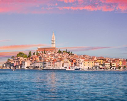 View of the sunset over the town seen from the sea on a luxury Croatia itinerary