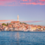 View of the sunset over the town seen from the sea on a luxury Croatia itinerary