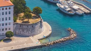 Aerial view of people on holiday in Zadar, relaxing next to Zadar's old town harbor 