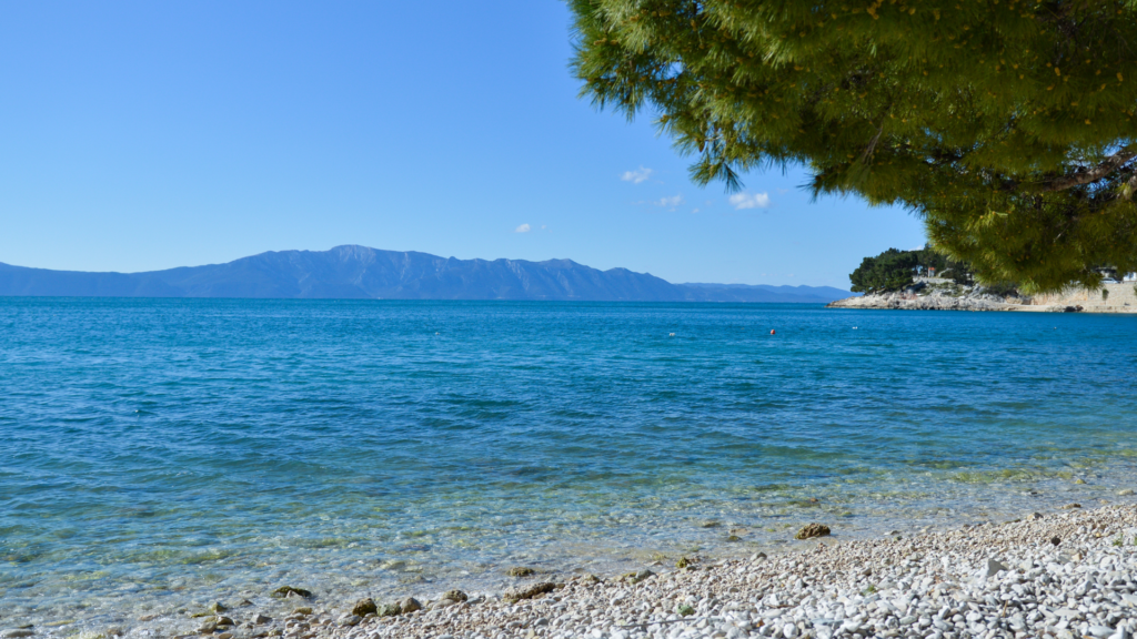 Drvenik beach, a hidden gem in Croatia, with clear blue waters and a pebble shore 